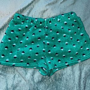 Short, soft pajama shorts, green with little black and white specks everywhere